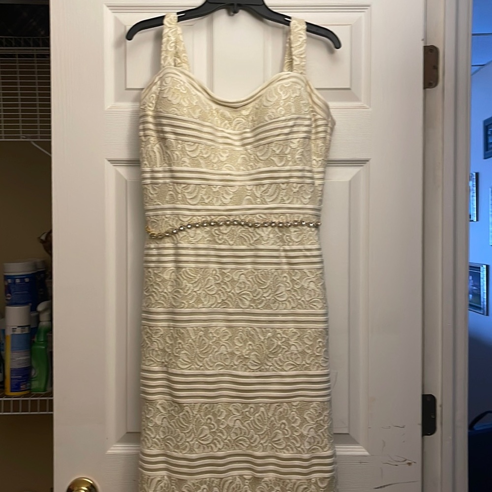 Beautiful dress was worn once for my second wedding.  It was hemmed to fit 5'3